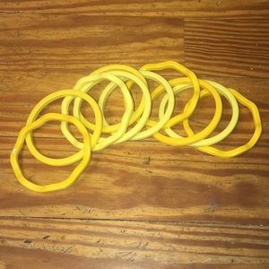 10 vintage yellow plastic bangles